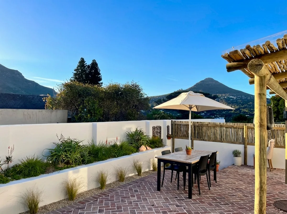 Ibis Cottage outdoor dining on the brick patio with mountain views